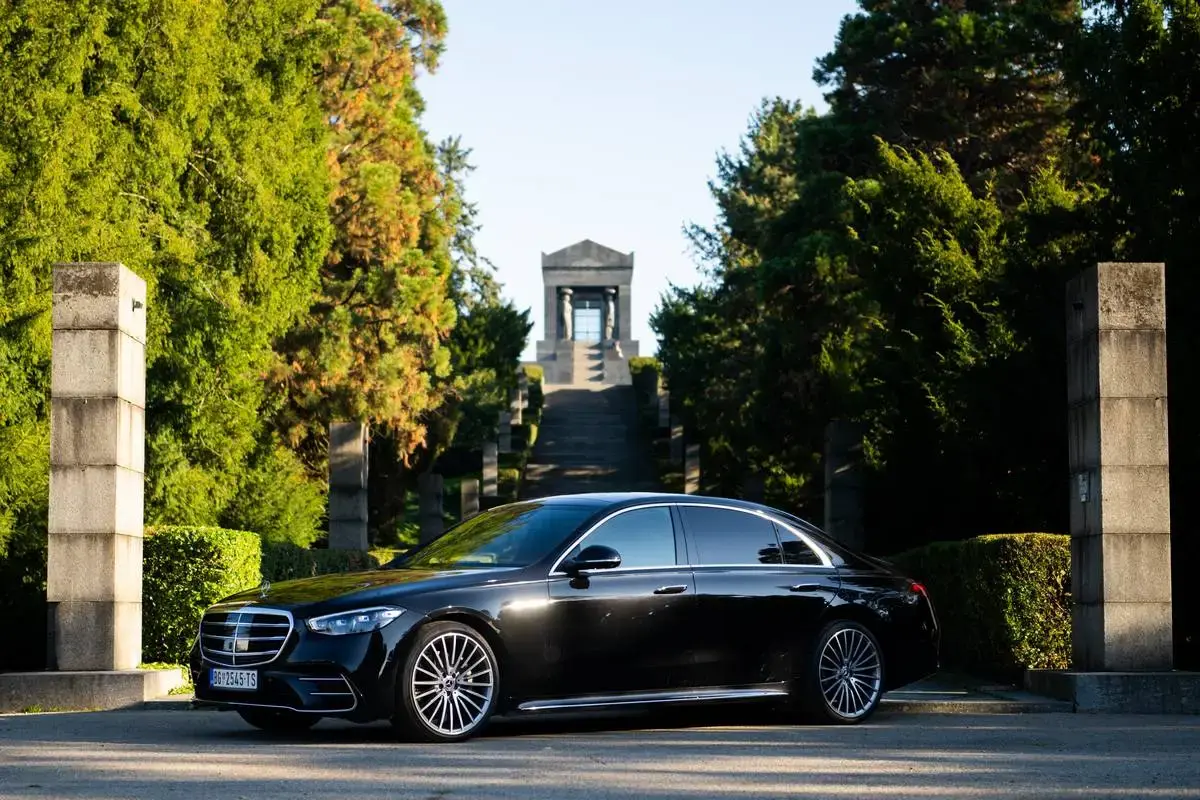 Black Mercedes-Benz S-Class viewed from the front and side.